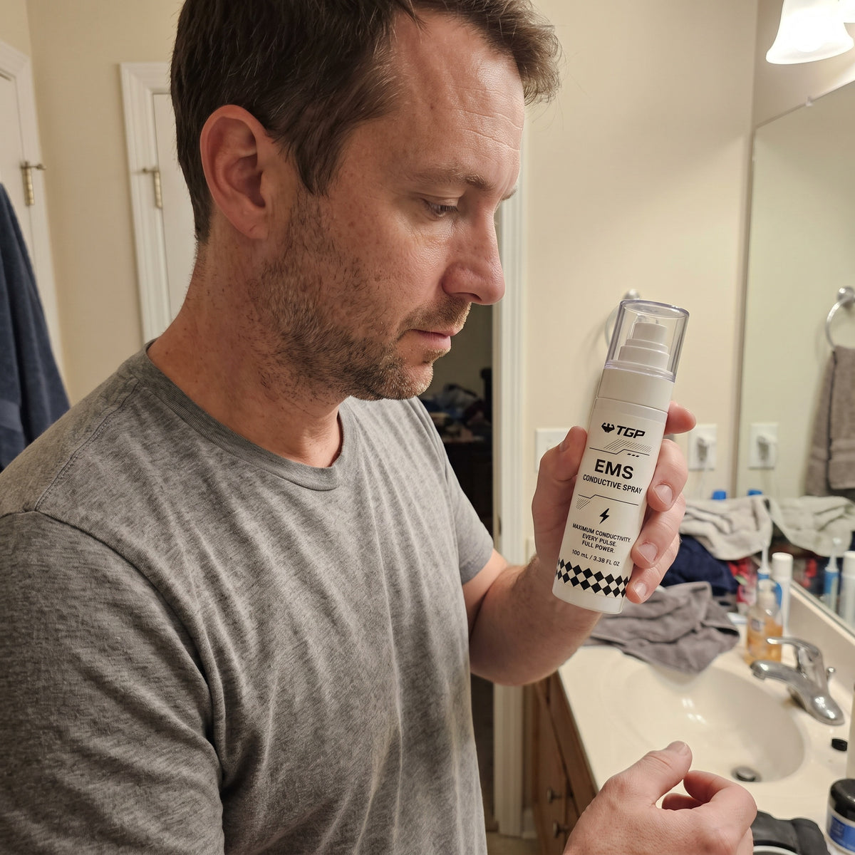 Shaking the TGP EMS Conductive Spray before use